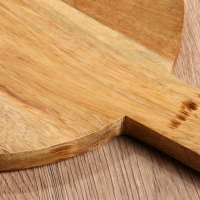 Доска разделочная круглая "Пряник" дерево манго 36х28 см