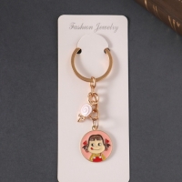 Брелок металл, эмаль "Девочка и леденец" 9 см