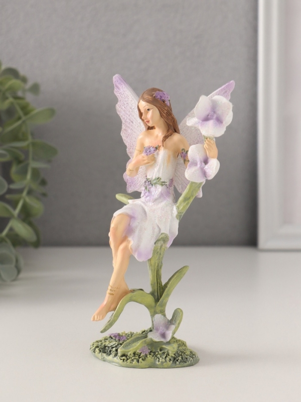 Сувенир полистоун "Девушка-фея в сиреневом платье на цветке" 7,5х6х14 см