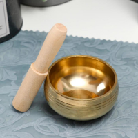 Поющая чаша металл золотая глянец с резонатором вн.диаметр чаши - 8,8 см 5,5х10х10 см Поющая чаша металл золотая глянец с резонатором вн.диаметр чаши - 8,8 см 5,5х10х10 см