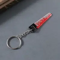 Брелок акрил зеркальный "Окровавленная пила" 5,1х1,3х0,3 см