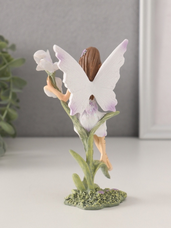 Сувенир полистоун "Девушка-фея в сиреневом платье на цветке" 7,5х6х14 см
