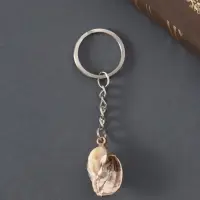 Брелок пластик "Ракушка в клетку" с золотом 3х2х1,2 см