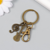 Брелок металл с карабином "Гитара и скрипичный ключ" бронза 6,5 см Брелок металл с карабином "Гитара и скрипичный ключ" бронза 6,5 см