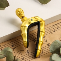 Каподастр для гитары Music Life Череп, золотой Каподастр для гитары Music Life Череп, золотой
