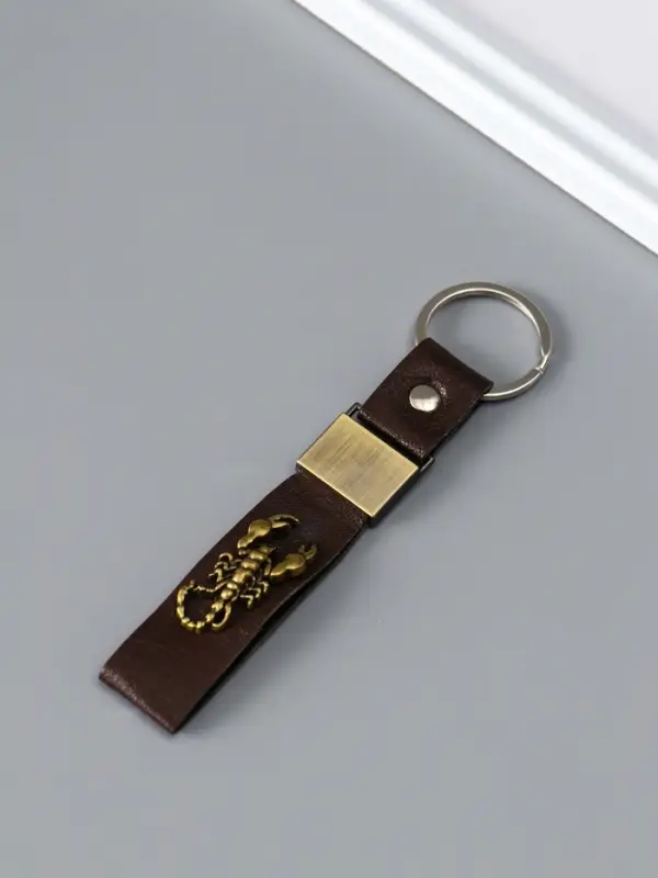 Брелок кожзам "Ремешок со скорпионом" 2,2х10 см