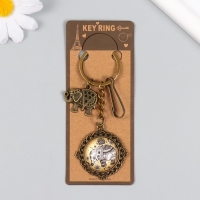 Брелок металл, стекло с карабином "Слон в медальоне" бронза 9,5 см