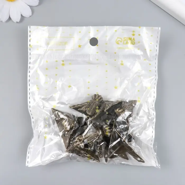 Уголок (ножка) для шкатулки металл "Фигурная" бронза 2,9х4 см