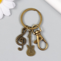 Брелок металл с карабином "Гитара и скрипичный ключ" бронза 6,5 см Брелок металл с карабином "Гитара и скрипичный ключ" бронза 6,5 см