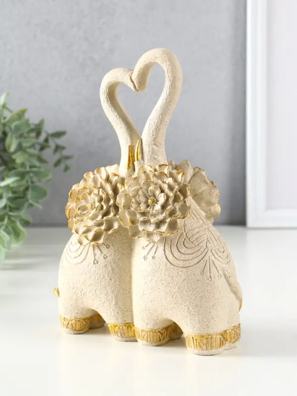 Сувенир полистоун " Парочка слонов с цветочными ушами" песочный 8х17х25,5 см
