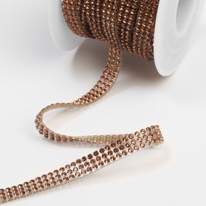 Стразы термоклеевые, d = 2 мм, ширина - 7 мм, 4,5 ± 0,5 м, цвет бронзовый Стразы термоклеевые, d = 2 мм, ширина - 7 мм, 4,5 ± 0,5 м, цвет бронзовый