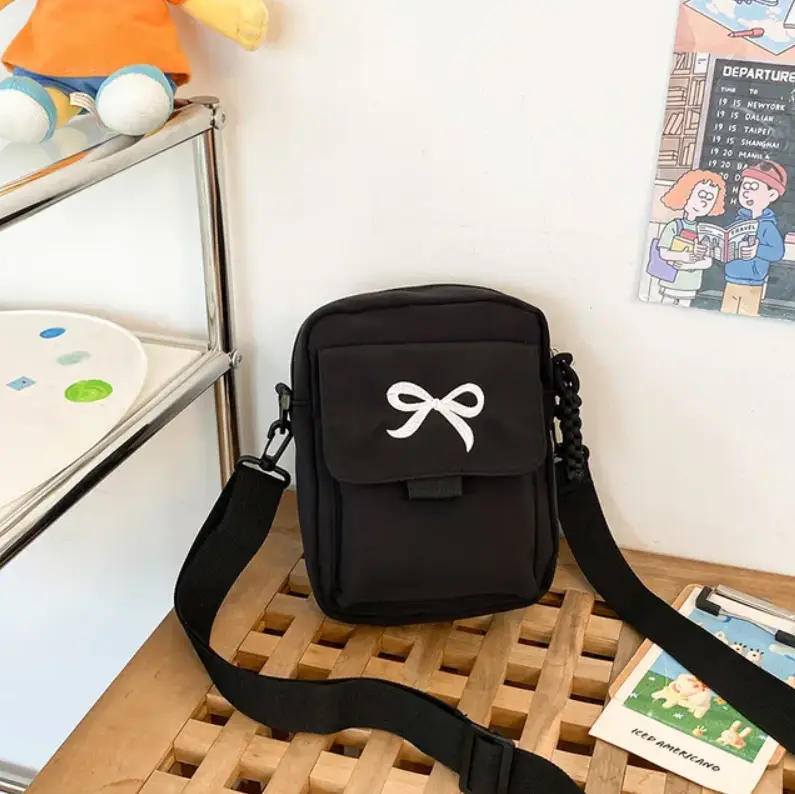 Сумка кросс-боди с бантиком черная