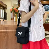 Сумка кросс-боди с бантиком черная